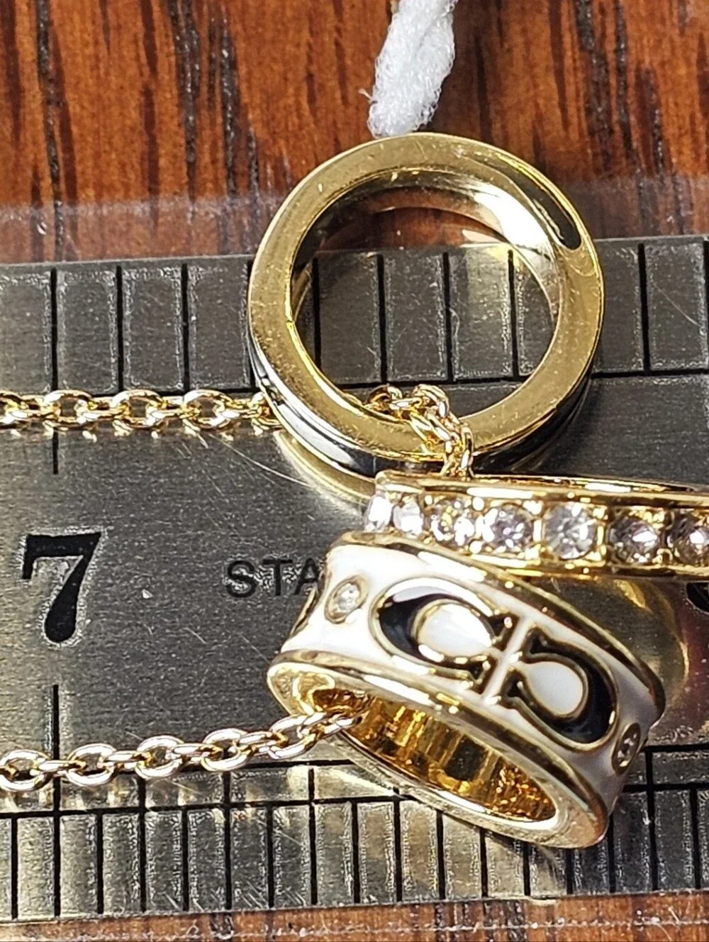COACH Gold and Black Pendant Necklace with Crystal Accents